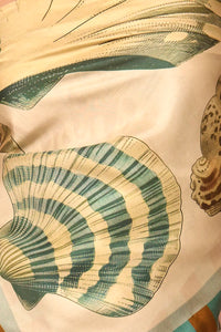Close up of the Coquille Scarf in Somers Shell Cream.