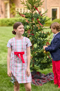 Little English classic children's clothing. Girls A-line dress in red and green plaid with red bow and red piping detail for the holidays