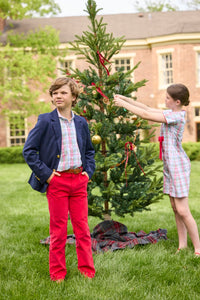 Little English classic children's clothing. Girls A-line dress in red and green plaid with red bow and red piping detail for the holidays.  Boys Douglas Plaid button down shirt with red corduroy pants and navy wool blazer.