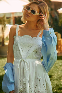 The Clarke Shirt has a cropped, boxy fit, a collared neckline, a button front and wide sleeves.
