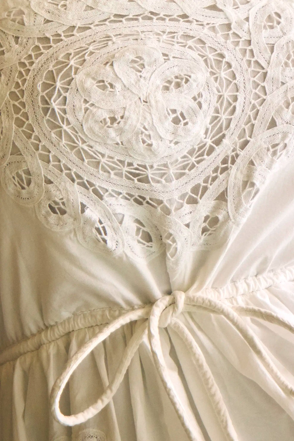 The Cosette Dress in Battenberg Cotton Lace has a relaxed silhouette and drawcord waist