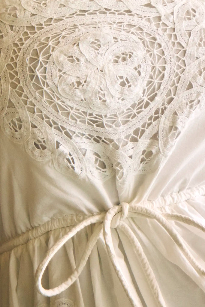 The Cosette Dress in Battenberg Cotton Lace has a relaxed silhouette and drawcord waist