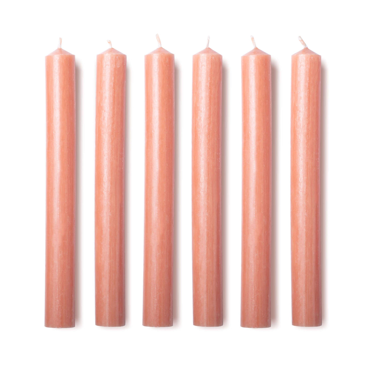 Front view of six Cosmos Orange dinner candles showcasing hand-drawn texture against a white background