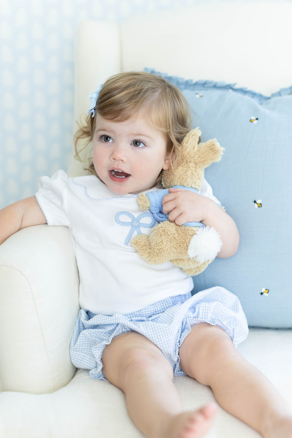 Little English traditional children's clothing.  Toddler girl's white short-sleeve peter pan blouse with crochet blue bow for Spring