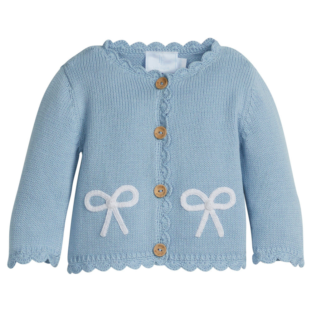 Little English traditional children's clothing.  Baby girl's blue with white bow crochet cardigan sweater for Spring.  Gift clothing for baby girl