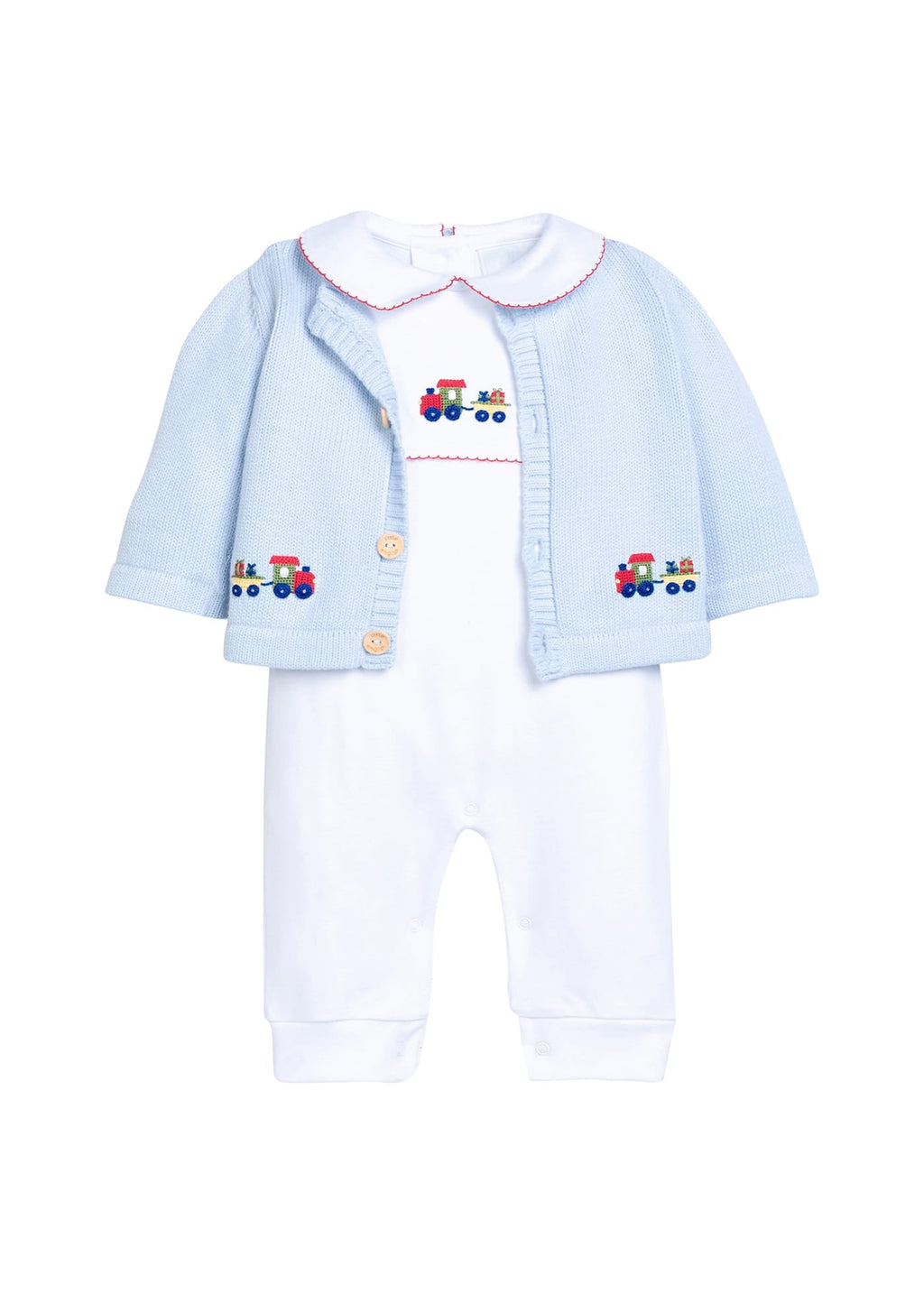 Little English traditional children's clothing.  Light blue cotton cardigan with crocheted holiday trains on either side and in back for baby boys. Layered over white pima cotton playsuit with red picot trim and holiday train crochet at the center chest