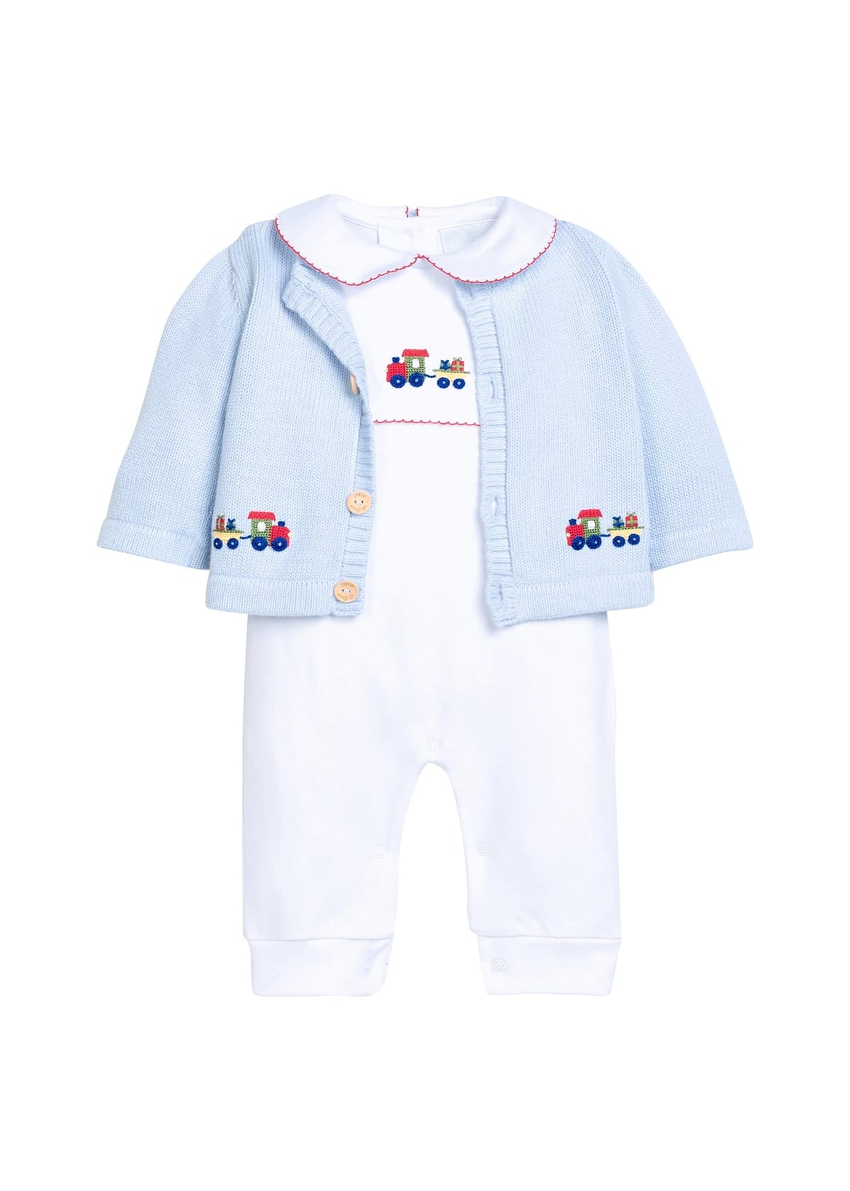 Little English traditional children's clothing.  Light blue cotton cardigan with crocheted holiday trains on either side and in back for baby boys. Layered over white pima cotton playsuit with red picot trim and holiday train crochet at the center chest