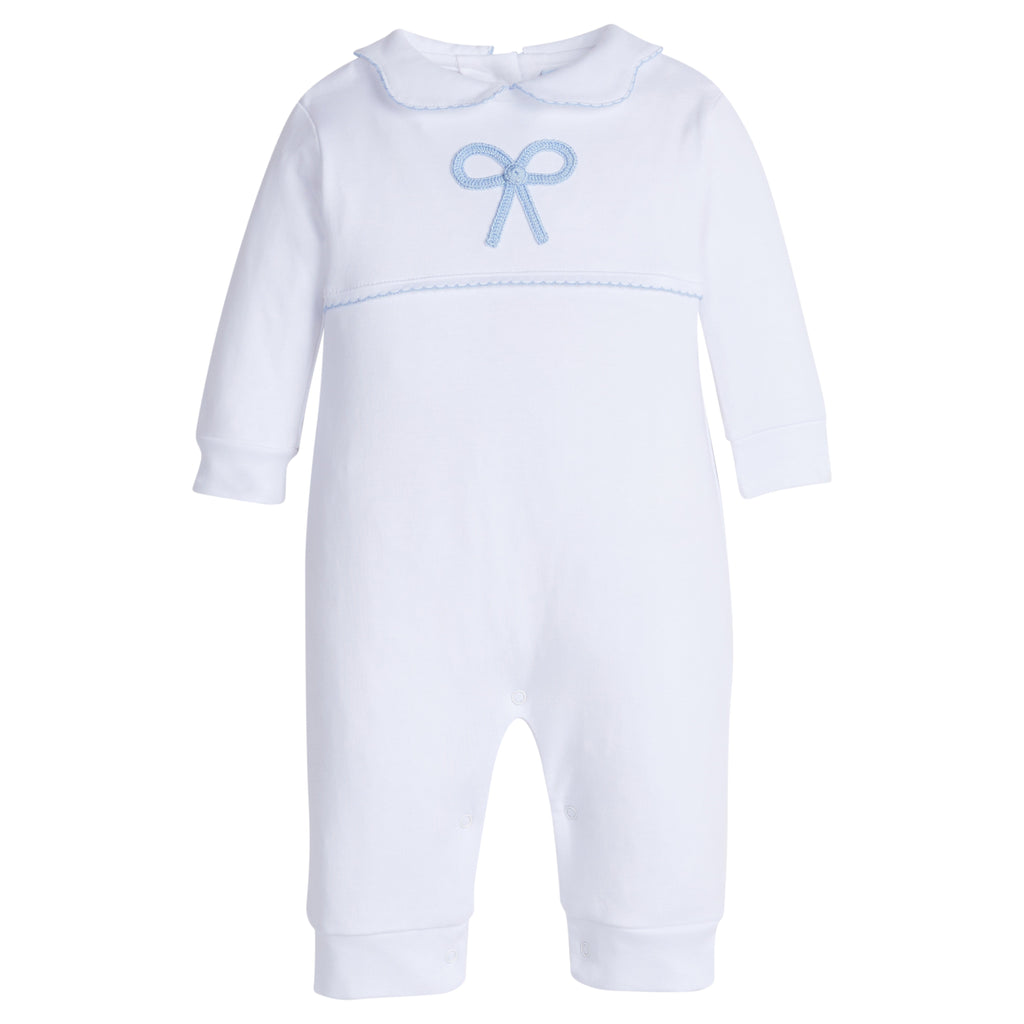 Little English traditional children's clothing.  Baby girl's white knit peter pan playsuit romper with blue bow crochet for Spring.  Gift clothing for baby girl