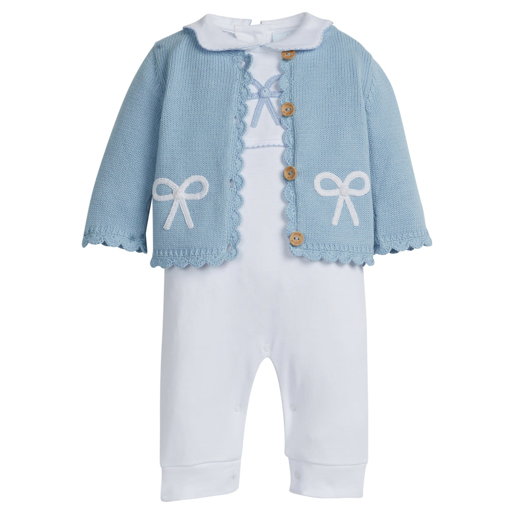 Little English traditional children's clothing.  Baby girl's white knit peter pan playsuit romper with blue bow crochet for Spring.  Gift clothing for baby girl