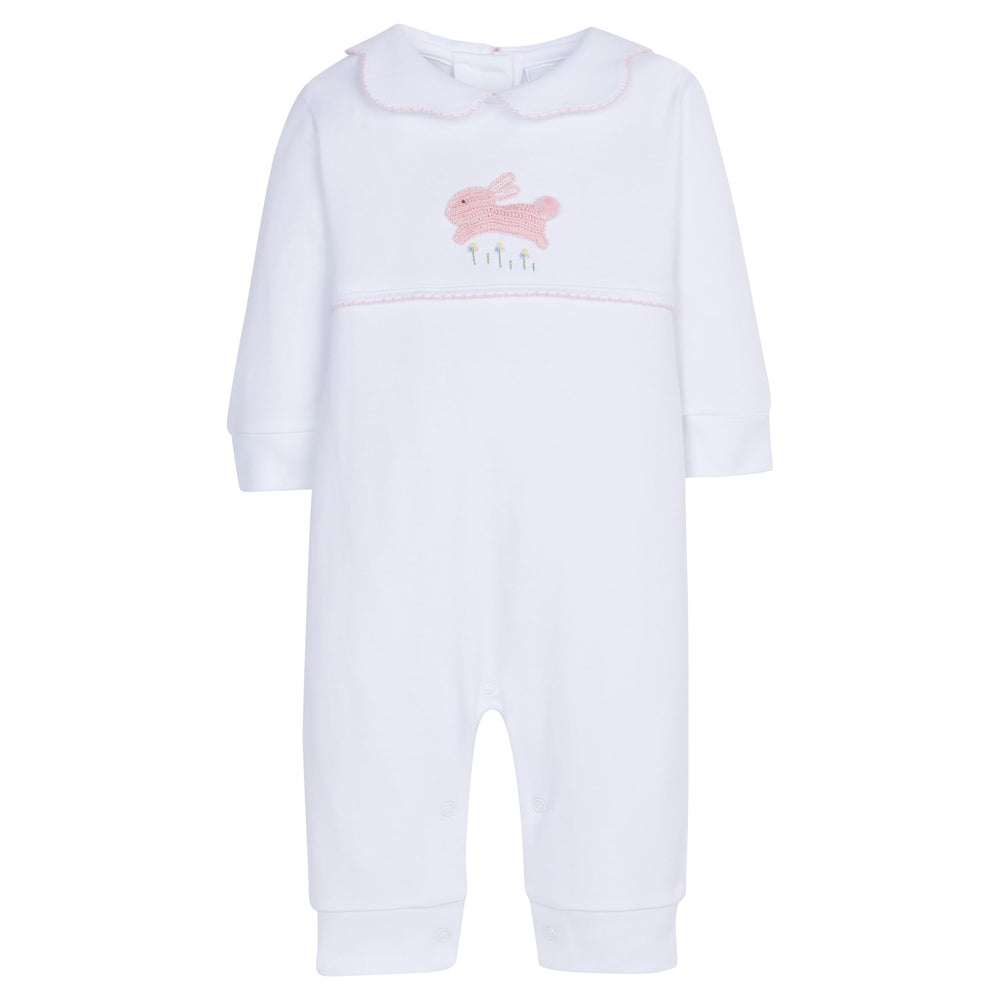 Front view of baby crochet playsuit showcasing hand-crocheted pink bunny at chest and Peter Pan collar with pink picot trim on white background