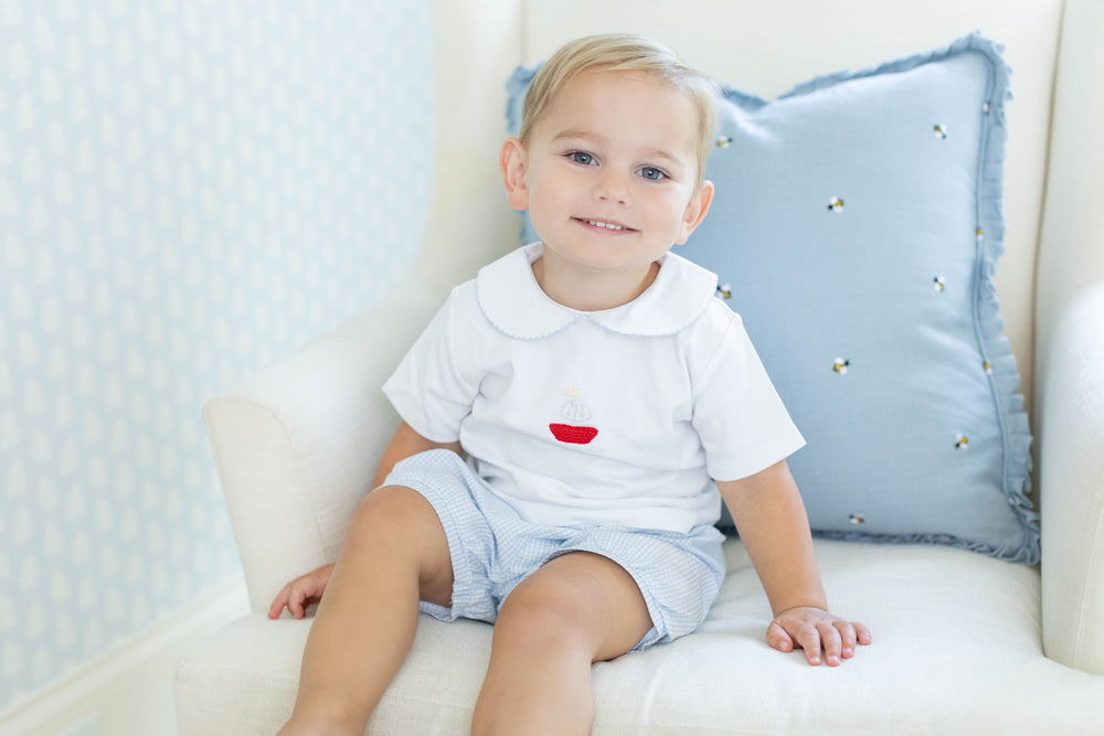 Little English traditional children's clothing.  Toddler boy's white knit peter pan shirt with sailboat crochet for Spring.  Gift clothing for toddler boy