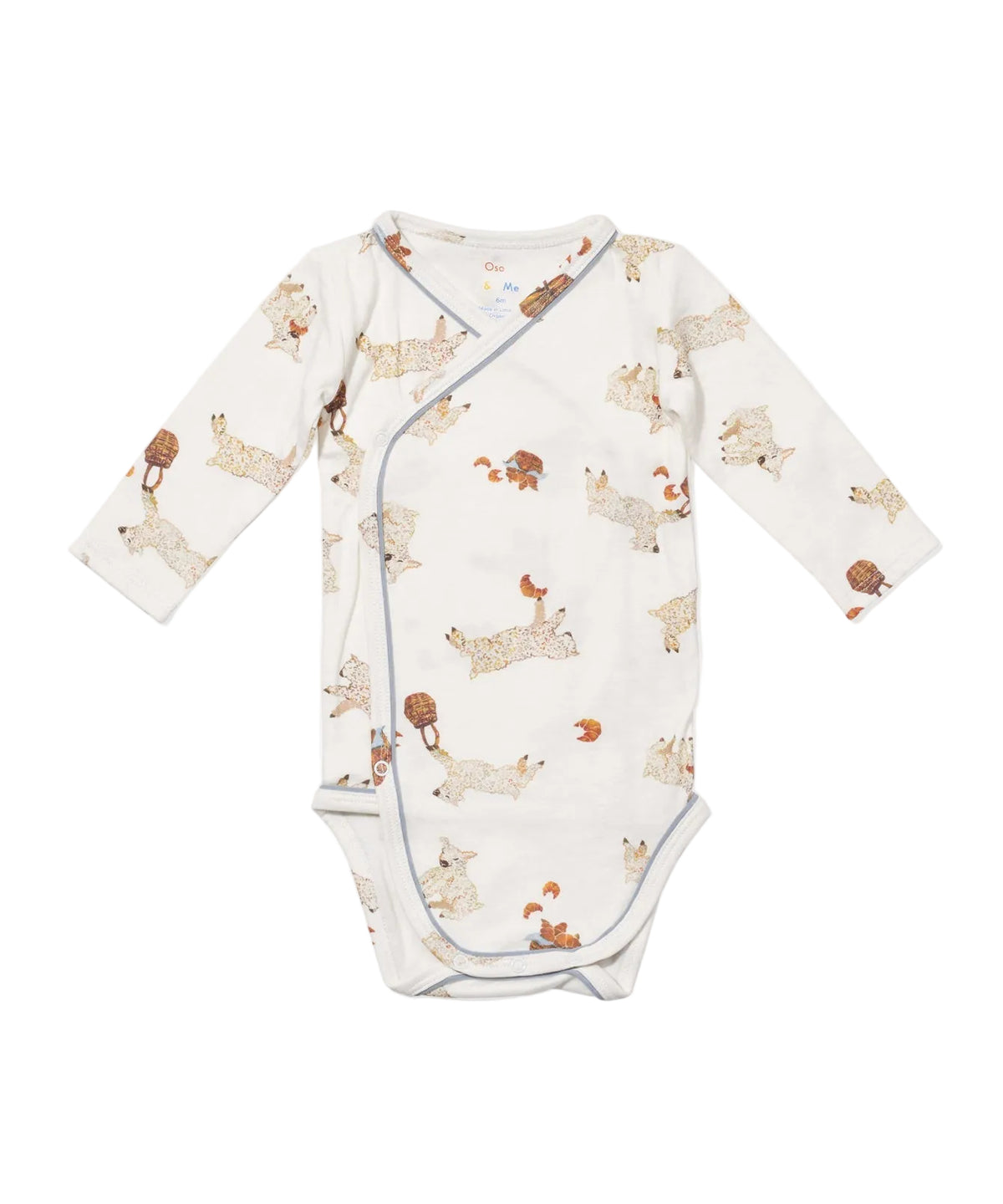 Flat lay front view of Crossbody One-Piece in Le Lamb print showcasing wrap-style opening, long sleeves, and snap closure on white background