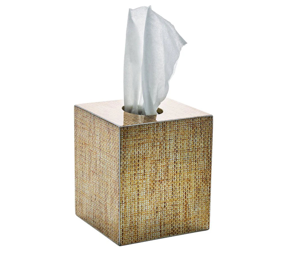 Three-quarter view of Angkor Tissue Box showcasing brown lacquered raffia with gold accents and a tissue emerging