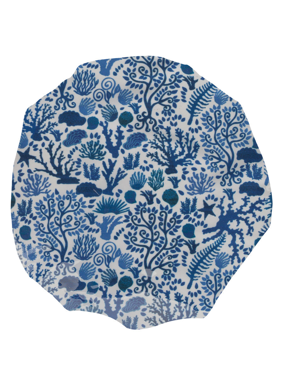 Top view of Seashells Blue shower cap showing blue seashell and coral print on white background
