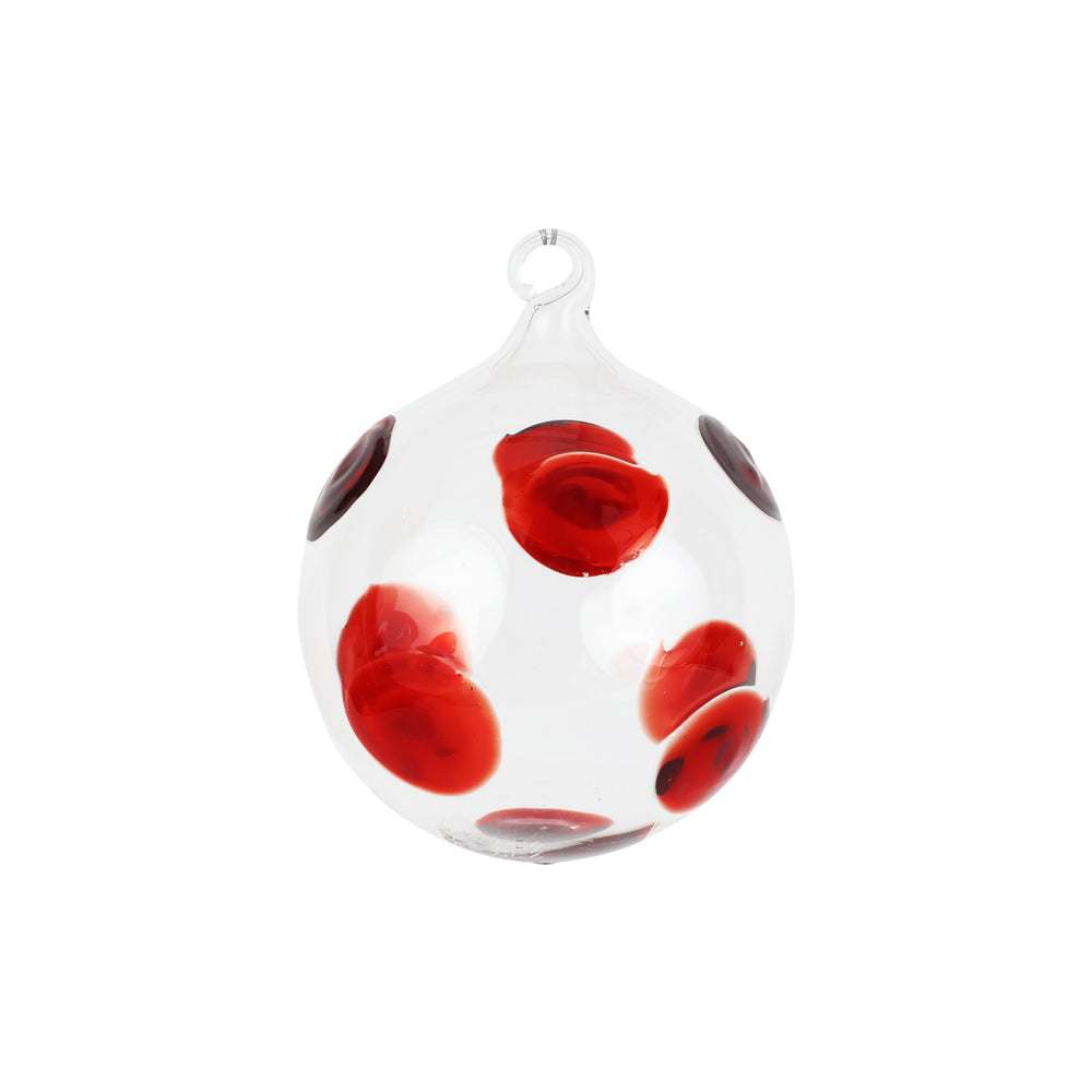 Front view of Drop Ornament in Red showcasing red polka dot accents on clear mouthblown glass with white background