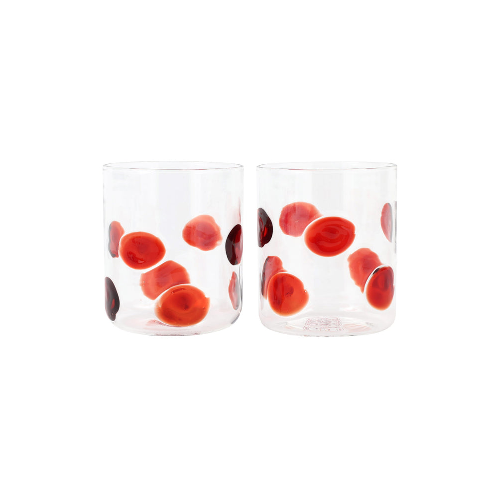 Front view of Drop double old fashioned glasses, set of 2, showcasing red dot pattern on clear glass against white background