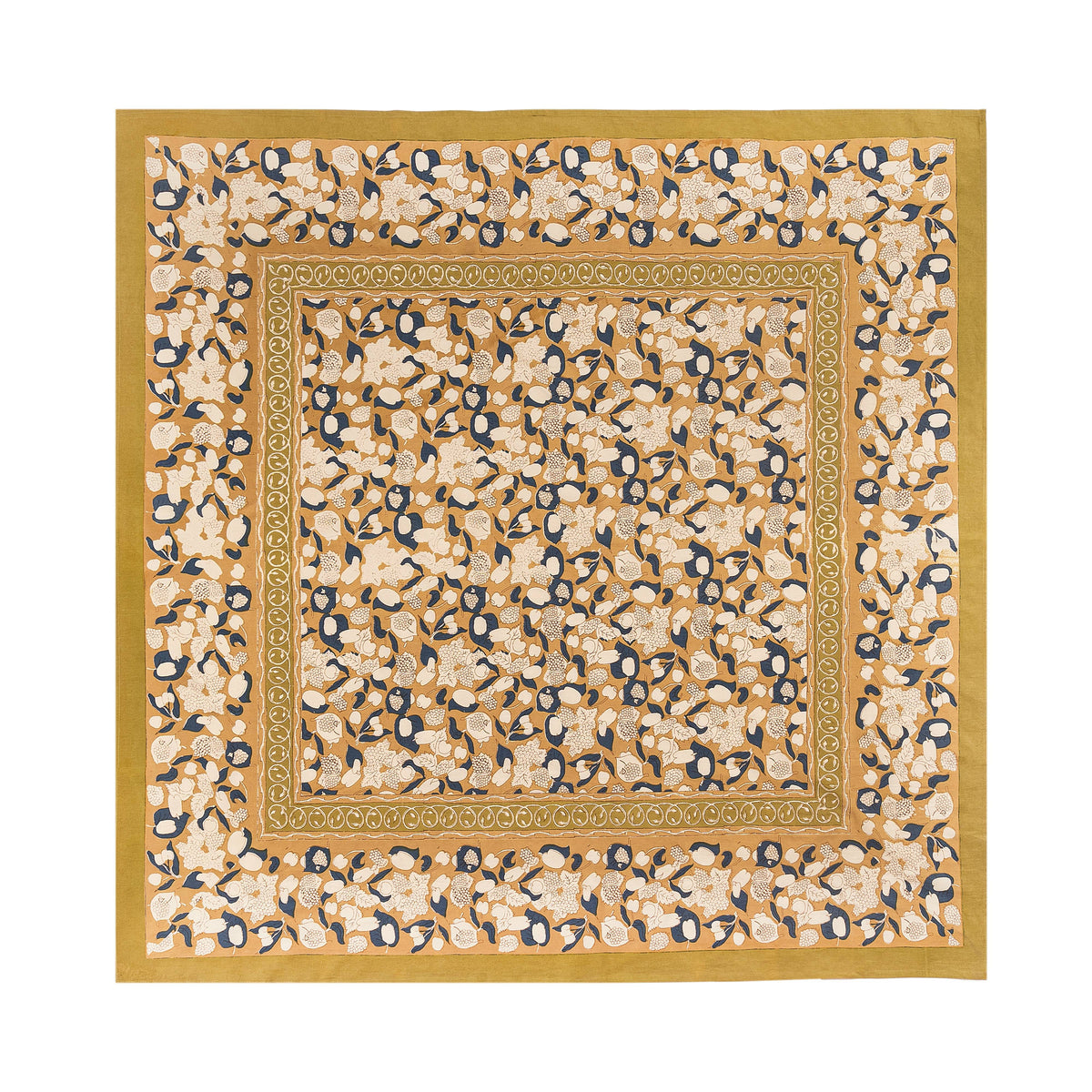 Close up of French Tablecloth Forest Harvest in mustard and blue showcasing fruit and foliage pattern on white background