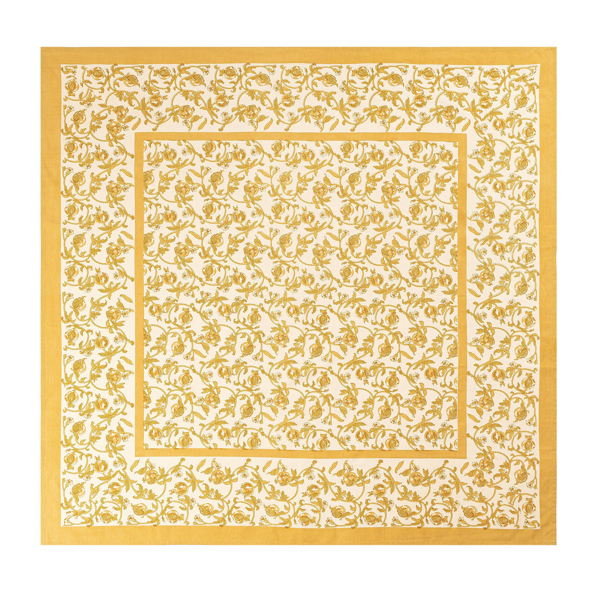 Close-up of French Tablecloth Granada Mustard showcasing intertwined mustard pomegranates and floral pattern on a white background