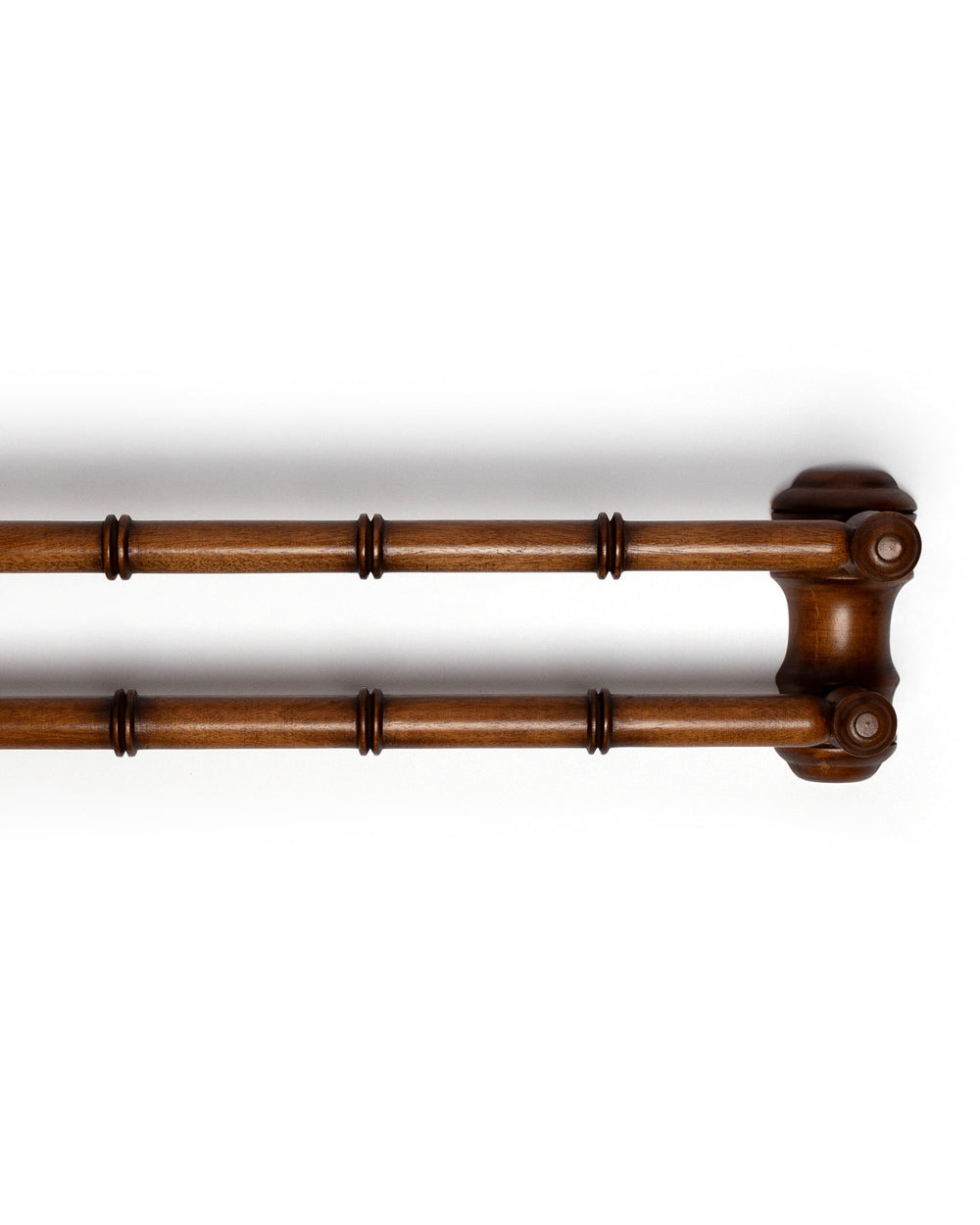 Right-side view of double-bar wooden towel rail showcasing faux-bamboo turned detailing and warm walnut finish on white