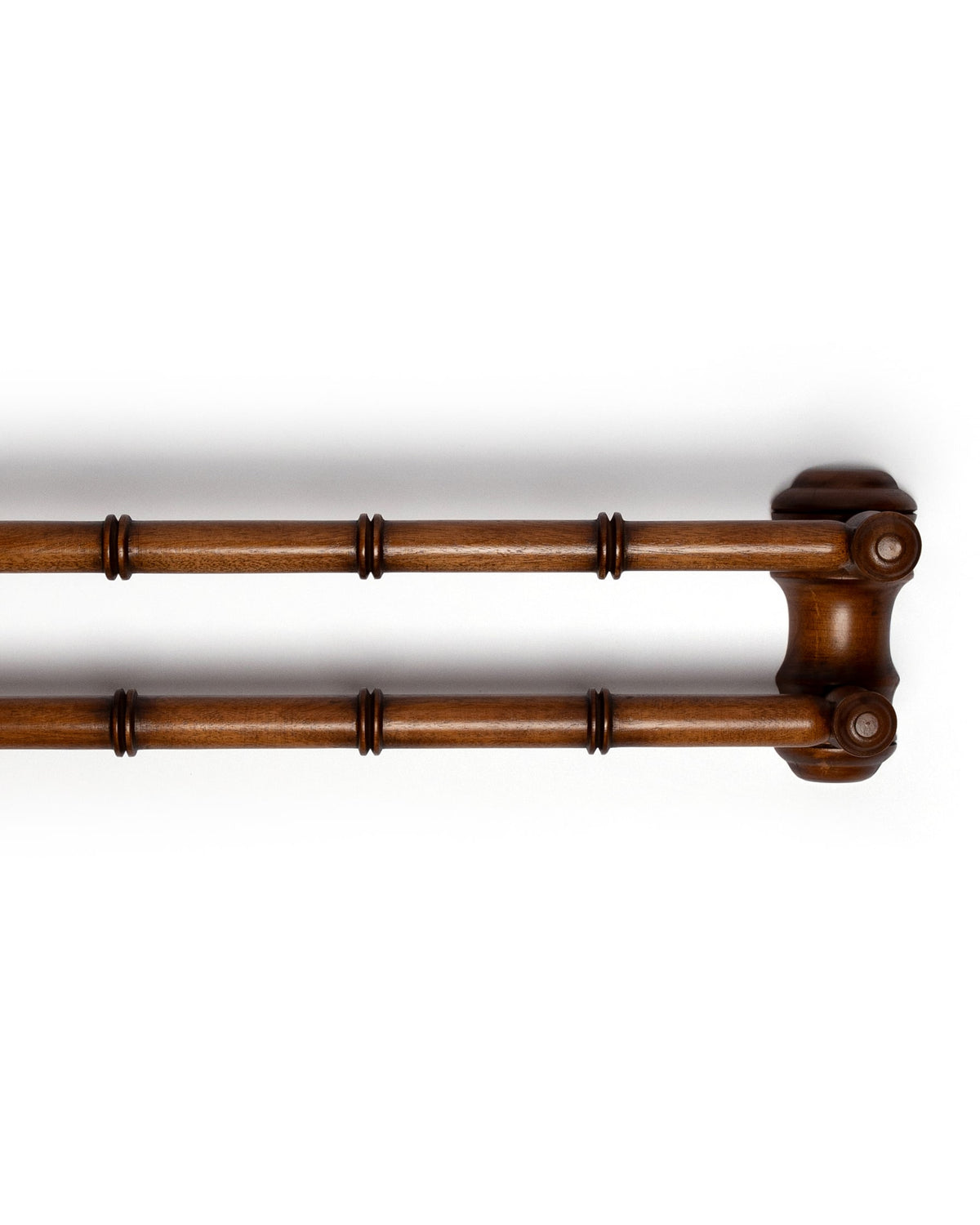Right-side view of double-bar wooden towel rail showcasing faux-bamboo turned detailing and warm walnut finish on white
