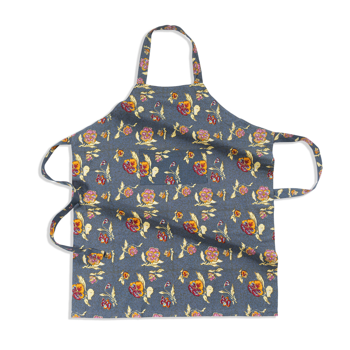 Flat-lay of Pansy apron showcasing red and yellow pansy floral print, center front pocket, neck loop and waist ties on grey background