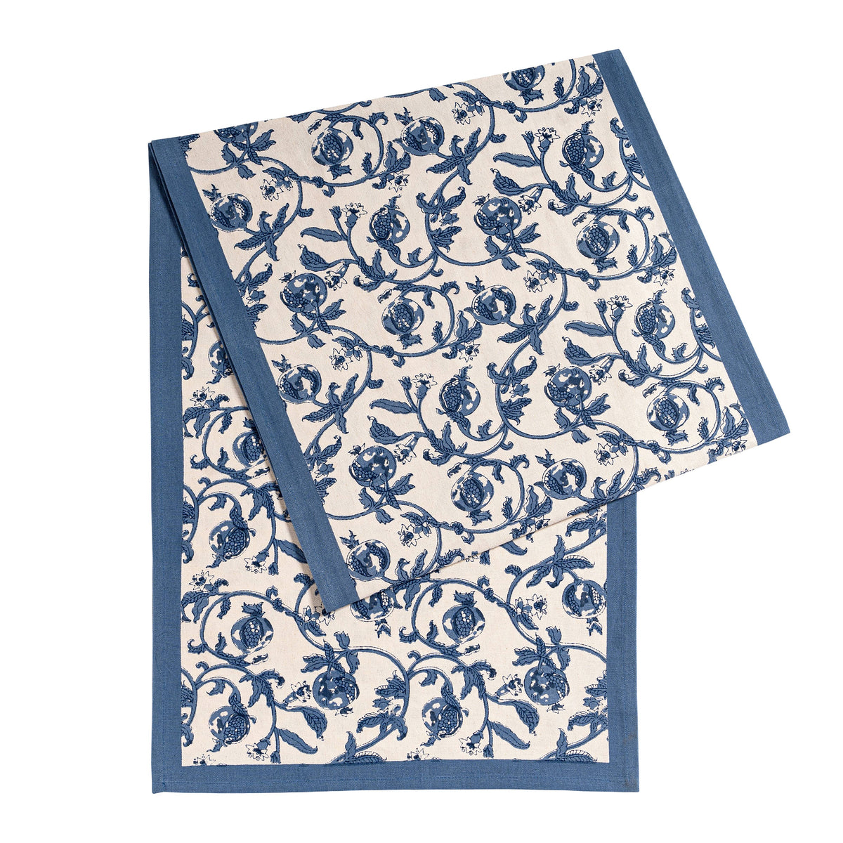 Angled view of Granada Runner in Cornflower Blue showcasing floral pattern and pomegranates on white background