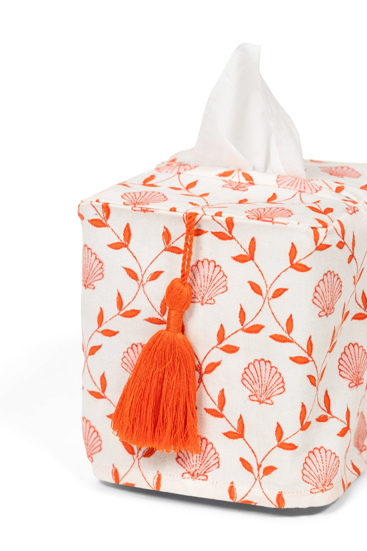 White fabric tissue box cover with orange seashell blockprint and tassel