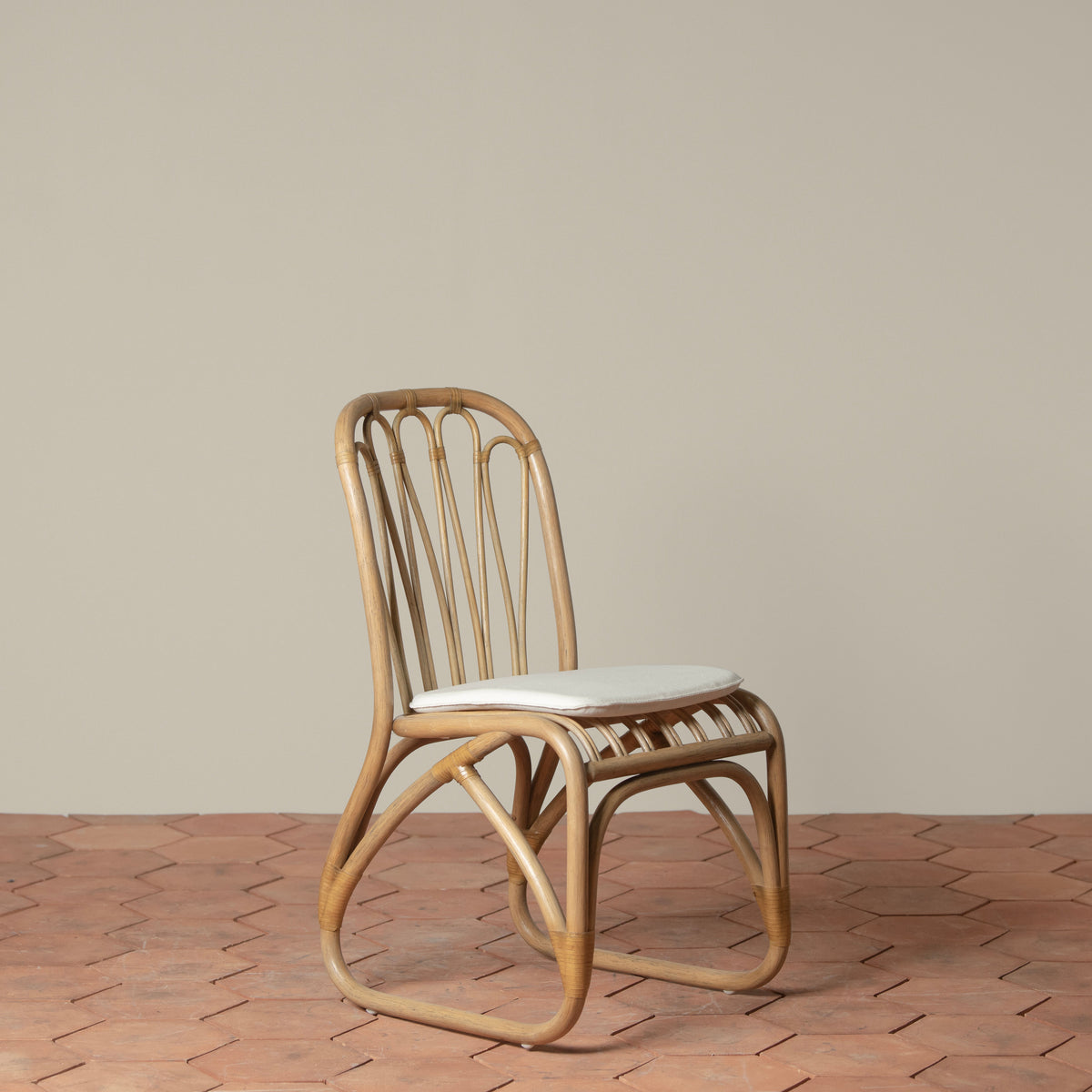 bastide rattan dining chair with linen cushion side