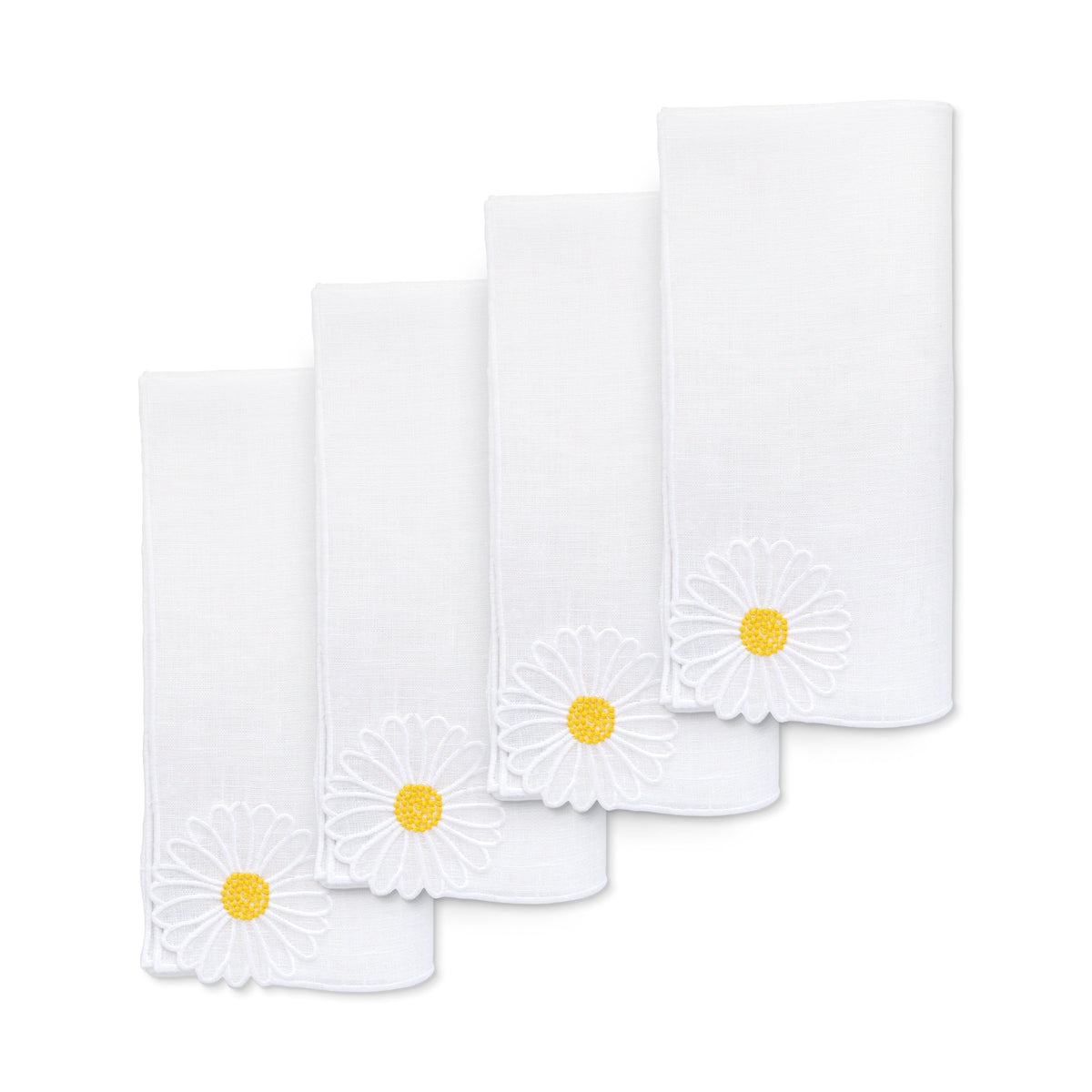 Close-up of Daisy Linen Dinner Napkins, set of 4, showcasing embroidered daisy corners on white linen with a white background
