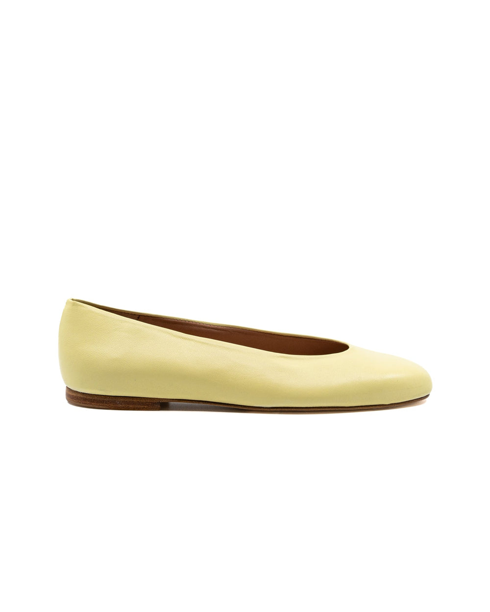 Side view of Dalia Butter Leather Ballerina showcasing pale yellow leather upper and low flexible sole on a white background