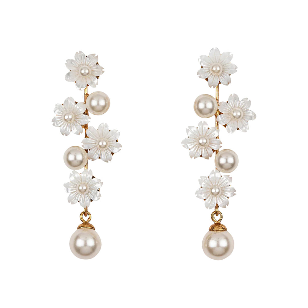 Front view of Calissa earrings with carved mother-of-pearl flowers and pearl drops on gold posts against white background