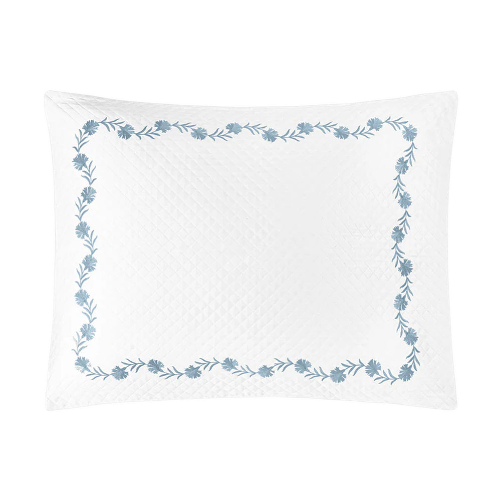 Front view of Daphne Matelasse sham showing blue floral embroidered border and diamond matelasse texture on white background