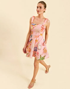 Darling Convertible Midi Dress in Seashell Symphony linen with strappy bodice, removable tiers, and convertible midi-to-mini silhouette.