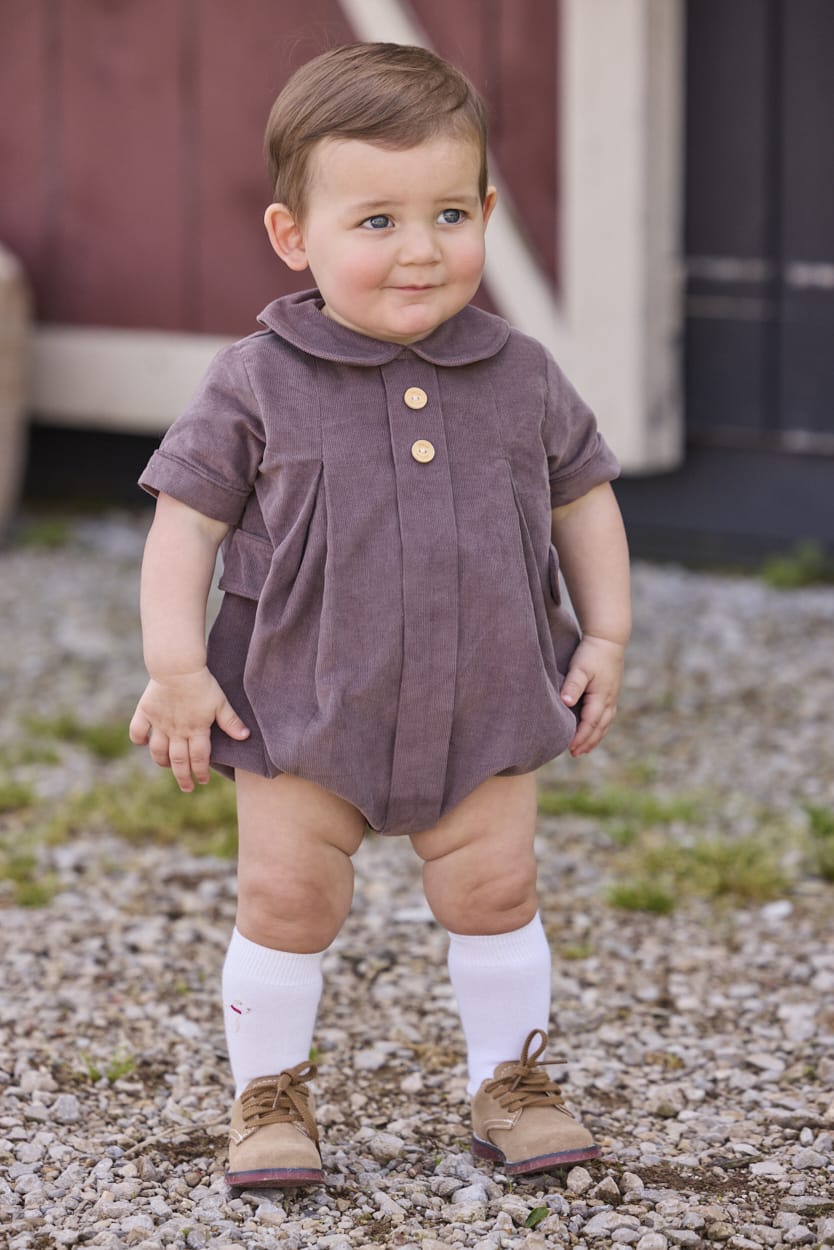Little English traditional children's clothing company.  Short sleeve peter pan bubble in chocolate brown corduroy with wood button details for baby boys