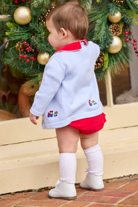 Little English classic children's clothing.  Red corduroy bubble with white contrast piping for baby boys for the holidays. Paired with light blue cardigan with holiday train embroidery