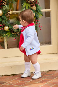Little English classic children's clothing.  Red corduroy bubble with white contrast piping for baby boys for the holidays. Paired with light blue cardigan with holiday train embroidery