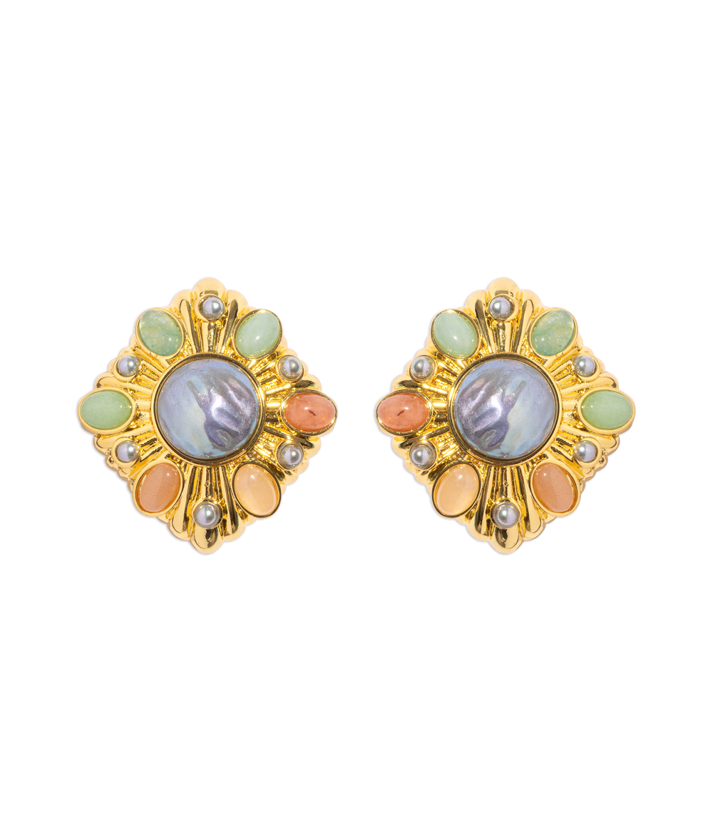 Front view of Davis earrings showcasing pastel cabochons and central iridescent stone on gold-tone frames on black background