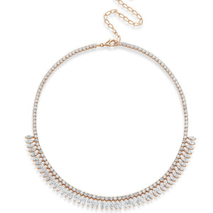 The Deco Feather Collar Necklace features marquise diamonds, teardrop-shaped diamond clusters, and a row of round diamonds on the front. Crafted in 18k white and rose gold, it has an adjustable chain with a lobster clasp.
