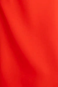 The Delancey Dress is long-sleeve with a shirred round neckline, banded cuffs, and a full skirt.