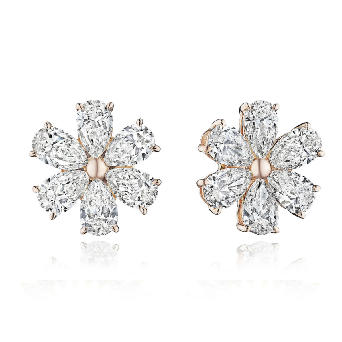 Floral Studs with Pear Shape Diamonds in Rose Gold: These flower-shaped earrings feature multiple SI clarity pear-shaped diamonds as petals around a central rose gold setting, shown against a white background.