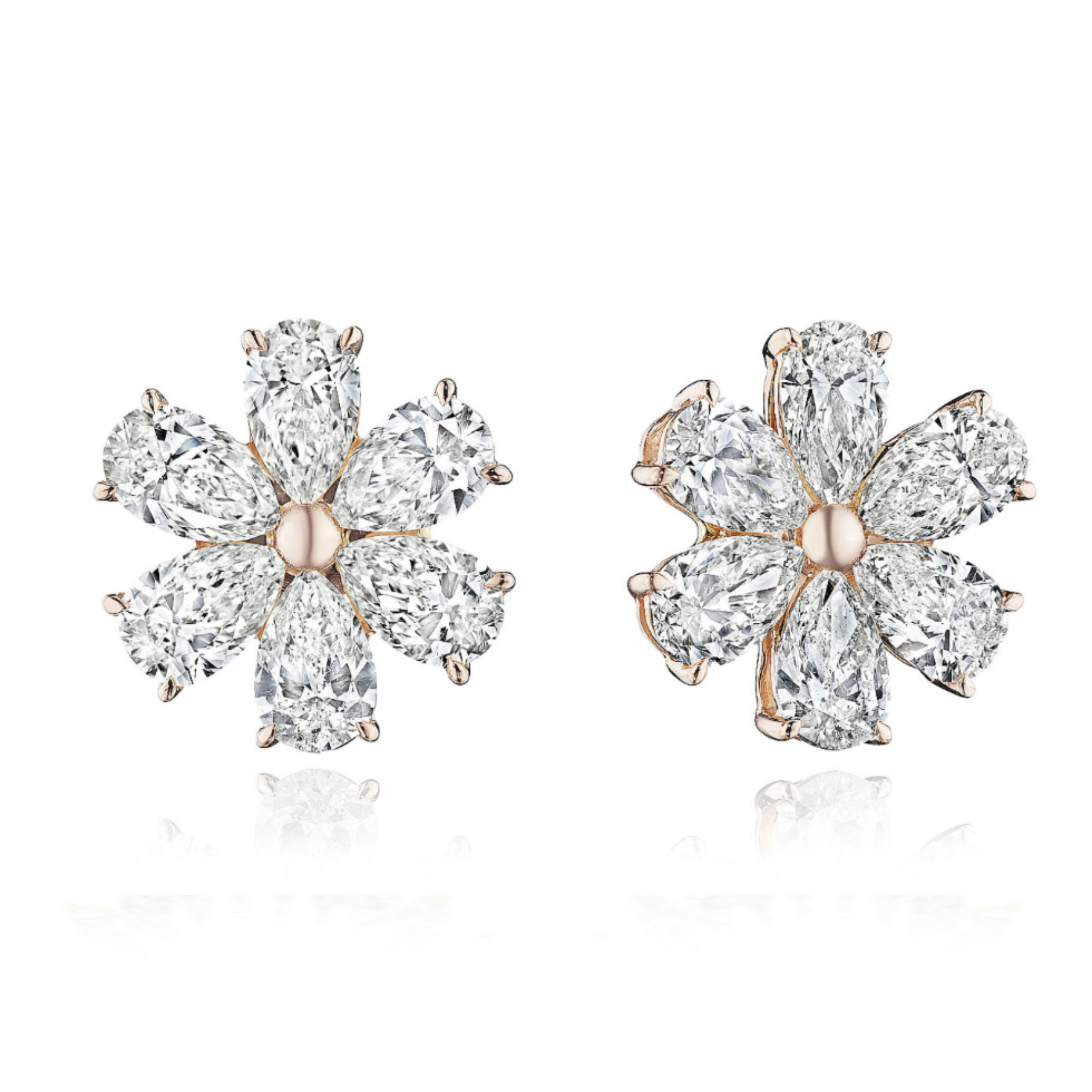 Floral Studs with Pear Shape Diamonds in Rose Gold: These flower-shaped earrings feature multiple SI clarity pear-shaped diamonds as petals around a central rose gold setting, shown against a white background.