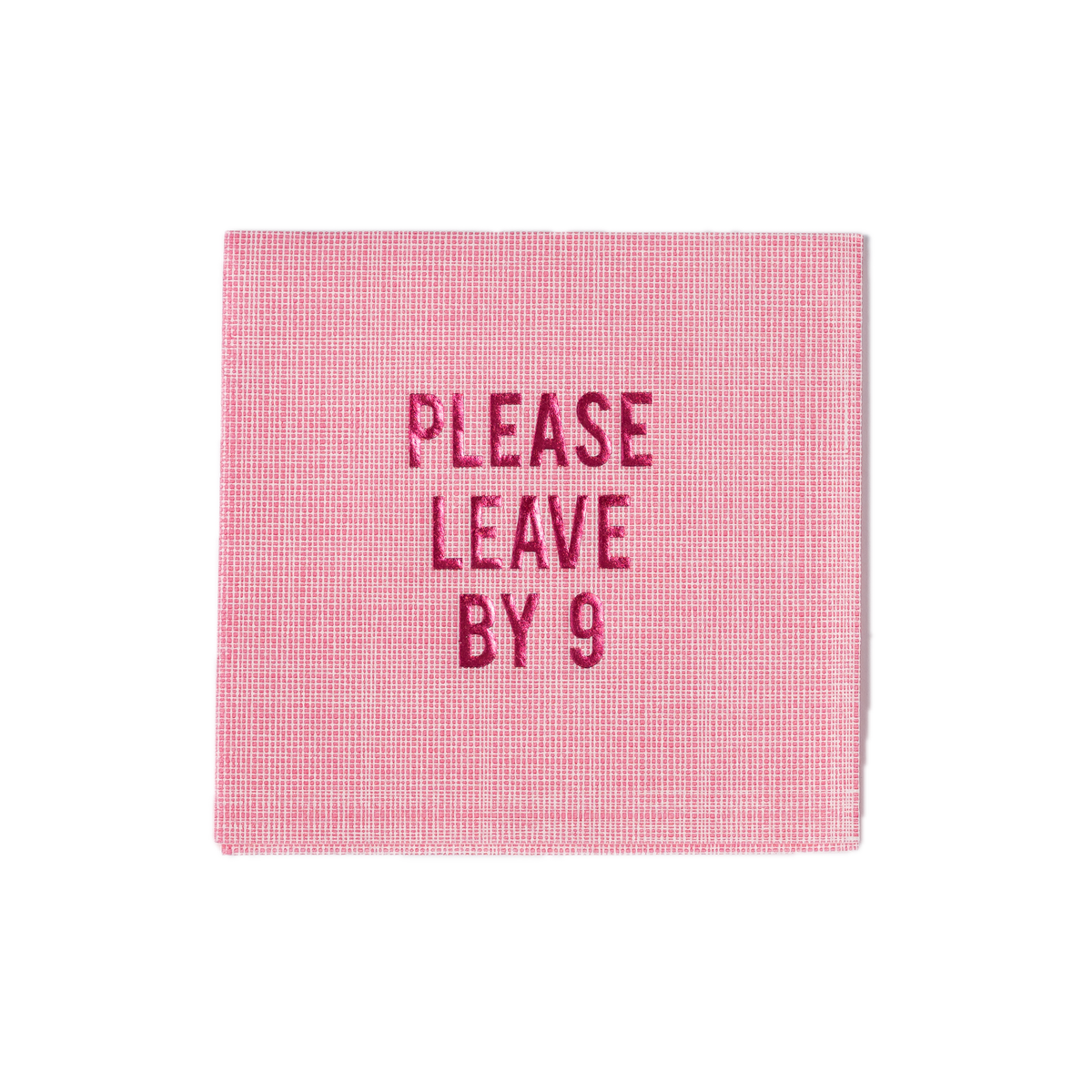 Front view of pink linen disposable cocktail napkin with PLEASE LEAVE BY 9 pink foil text and crosshatch texture on white background