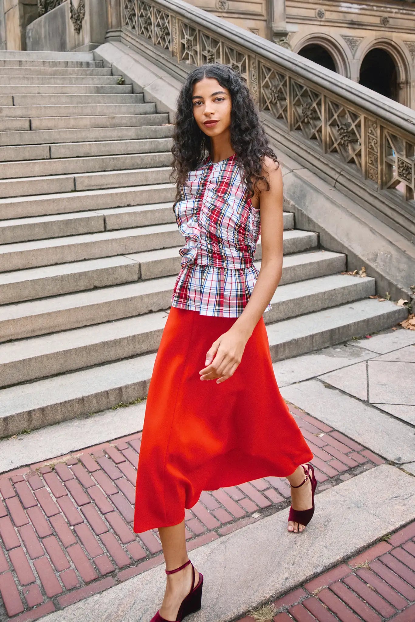 The Adele Skirt, cut on the circle from saturated red crepe with a clean waist and side seam zipper