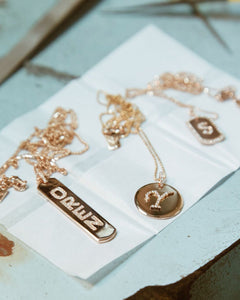 Longtag Necklace shown with the Renata Necklace, Initial Diamond Dogtag Necklace, and the Diamond Dogtag Necklace., 14k yellow gold, 14k yellow gold, 14k rose gold, 14k white gold