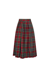 The Dominic Skirt has a banded waist and a straight pleated silhouette finished with front slits. 