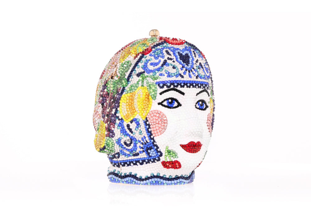 Three-quarter view of Singnorina Donna clutch showcasing crystal embellishments and floral and fruit motifs on white background