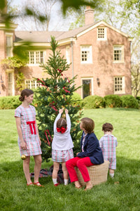 Little English classic children's clothing. Girls A-line Cora Dress in red and green plaid with red bow and red piping detail for the holidays.  Boys Douglas Plaid button down shirt with red corduroy pants and navy wool blazer. Toddler girls Eleanor Dress - Douglas Plaid with ruffled peter pan collar and tie sash in back paired with white Holiday Bow Fair Isle Cardigan.  Toddler boys Douglas Plaid Button Tab John John Set