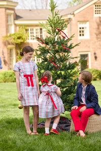 Little English classic children's clothing. Girls A-line Cora Dress in red and green plaid with red bow and red piping detail for the holidays.  Boys Douglas Plaid button down shirt with red corduroy pants and navy wool blazer. Toddler girls Eleanor Dress - Douglas Plaid with ruffled peter pan collar and tie sash in back.