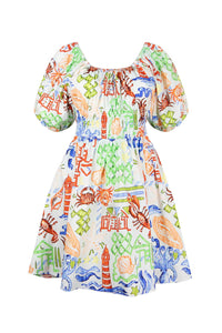 The Drew dress has a scoop neck with a drawstring tie, a smocked waist and a shirred mini skirt.
