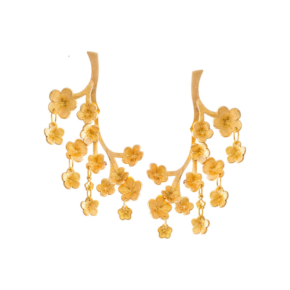 Front view of Sekiba earrings showcasing cascading hand-shaped brass cherry-blossom petals with dangling flowers on white background